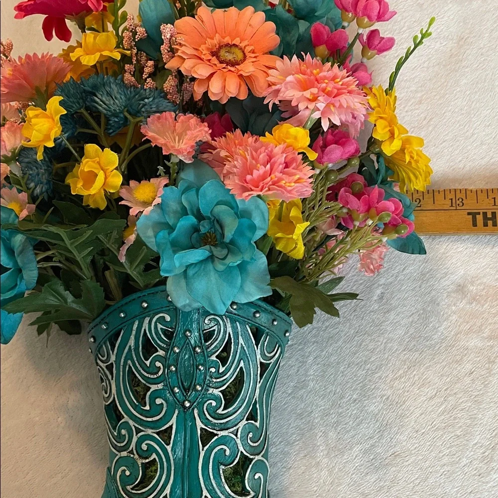Cute colorful silk arrangement in a resin decorative boot. 🌺